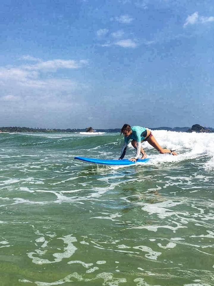 Shine On Spiritual Blogger Julie Jewels Bertrand learning to surf in sri lanka